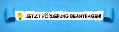 Bild mit Schriftzug "Jetzt Förderung beantragen!" und leuchtender Glühbirne